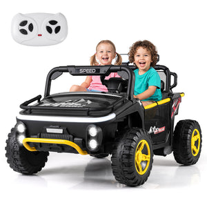 Children sitting in a toy car with a remote control on a white background