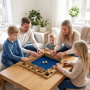 Family playing a board game together in a cozy living room.