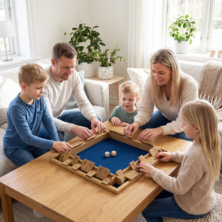 Family playing a board game together in a cozy living room.