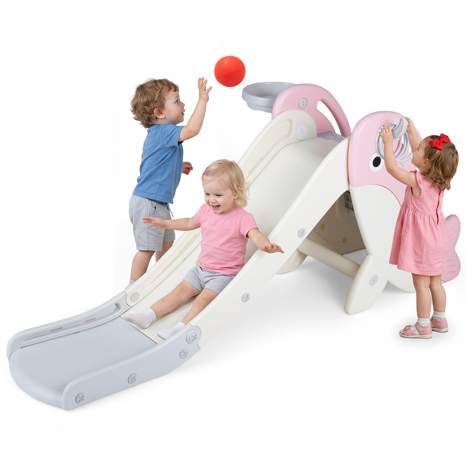 A children's outdoor play slide with a pink and cream whale-shaped design, shown with three children playing on a white background.