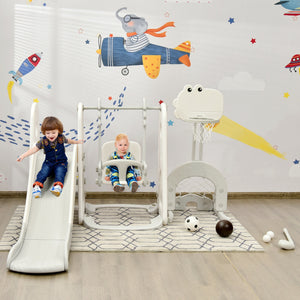 Children playing on a playground set with a colorful wall mural in the background.