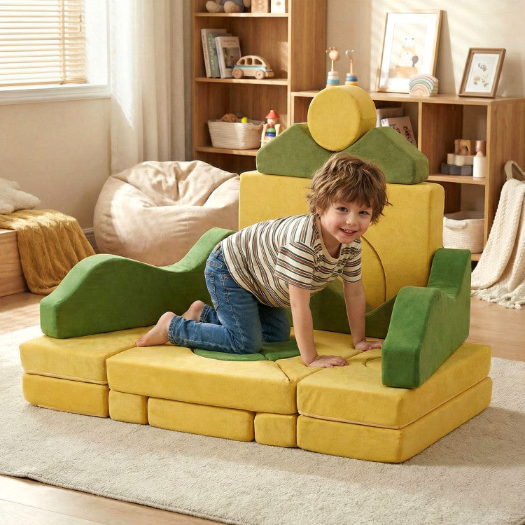 Child playing on a yellow and green foam play set in a room with bookshelves and bean bags.
