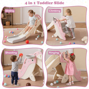 A children's slide in a bright room with three kids playing on it. The slide is white and pink with a playful animal face on the side, set on a light rug with wooden flooring and wall shelves in the background.