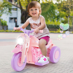 Child riding a pink toy motorcycle with bubbles in the background