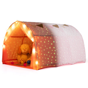Children's play tent with star patterns and a teddy bear inside, illuminated by small lights.