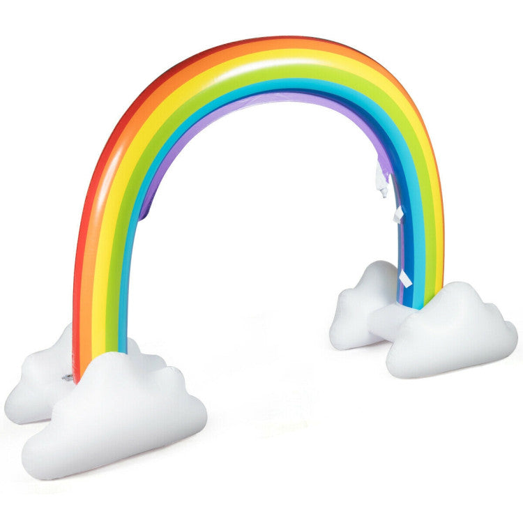 Kids running through rainbow‑shaped outdoor inflatable bounce house sprinkler