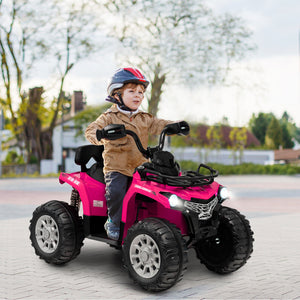 Child riding a pink toy ATV on a paved area with trees and buildings in the background