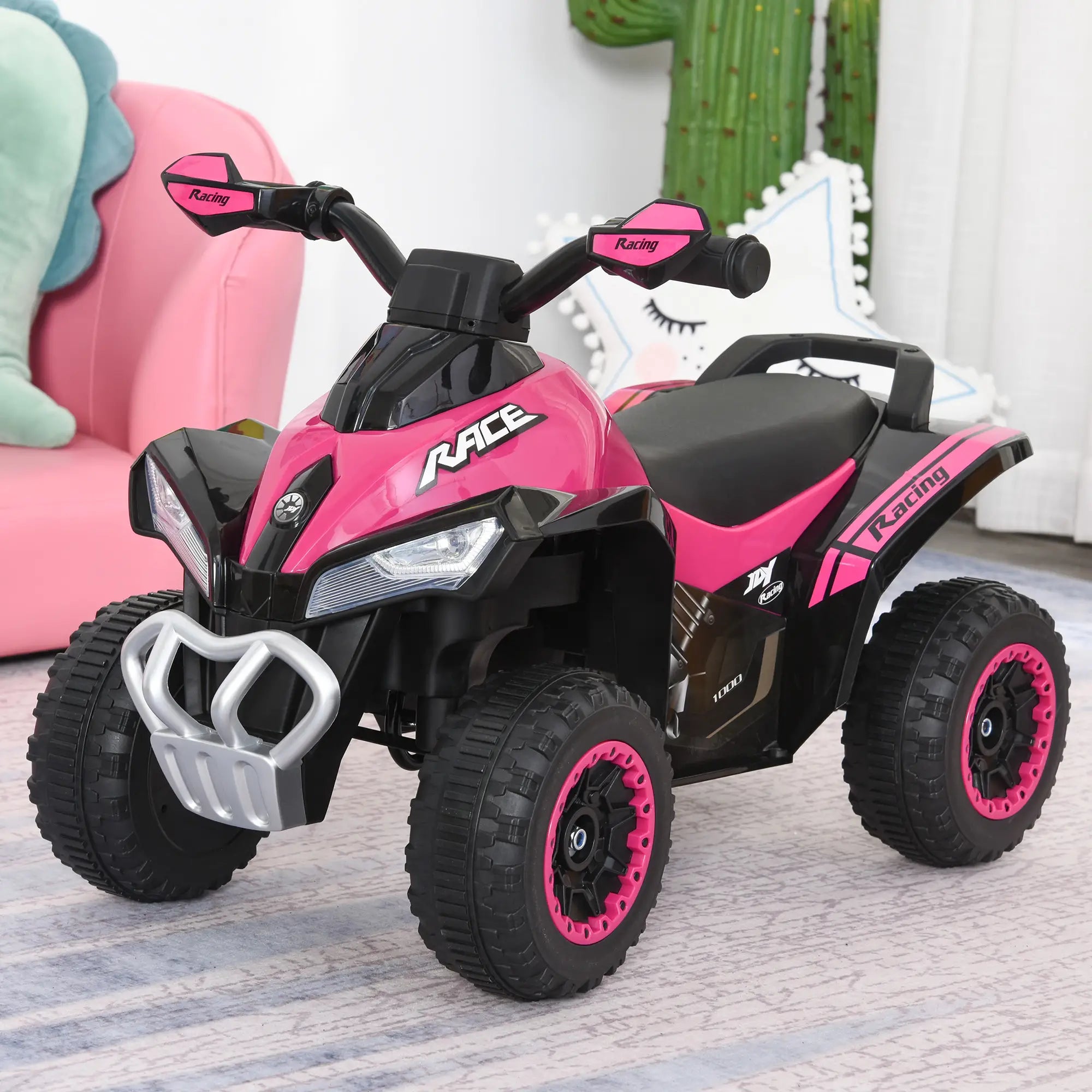 Pink and black toy ATV on a carpeted floor with a child's chair and cactus in the background.