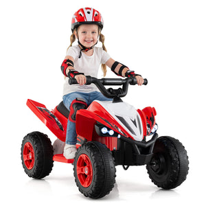 Child riding a red toy ATV with safety gear on a white background