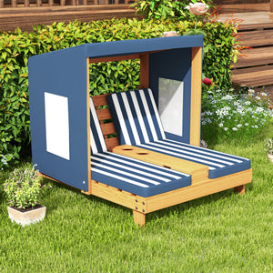 Wooden outdoor lounge chair with striped cushions in a garden setting