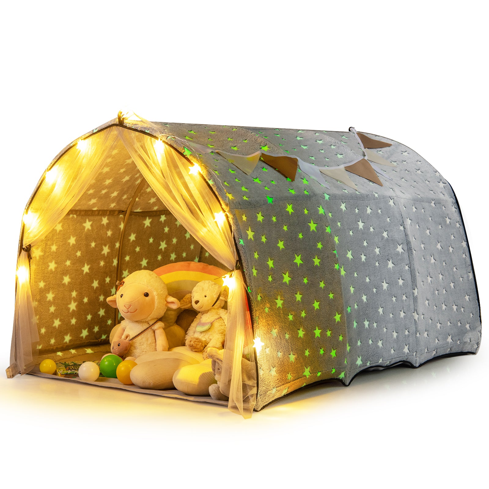Children's play tent with glowing stars and toys inside on a white background