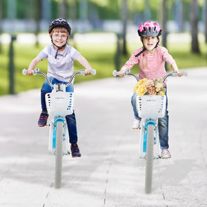 Two children riding bicycles on a paved path with trees in the background