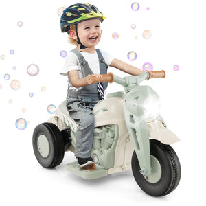 Child riding a toy motorcycle with bubbles in the background