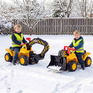 Two children playing with toy construction vehicles in a snowy backyard.