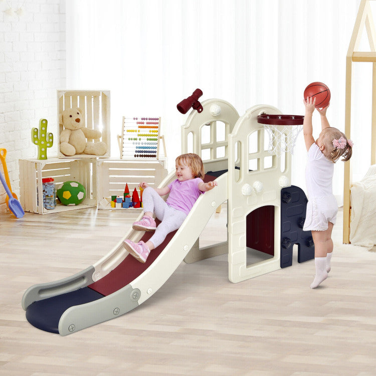 Children playing on a playset with a slide and basketball hoop in a room.