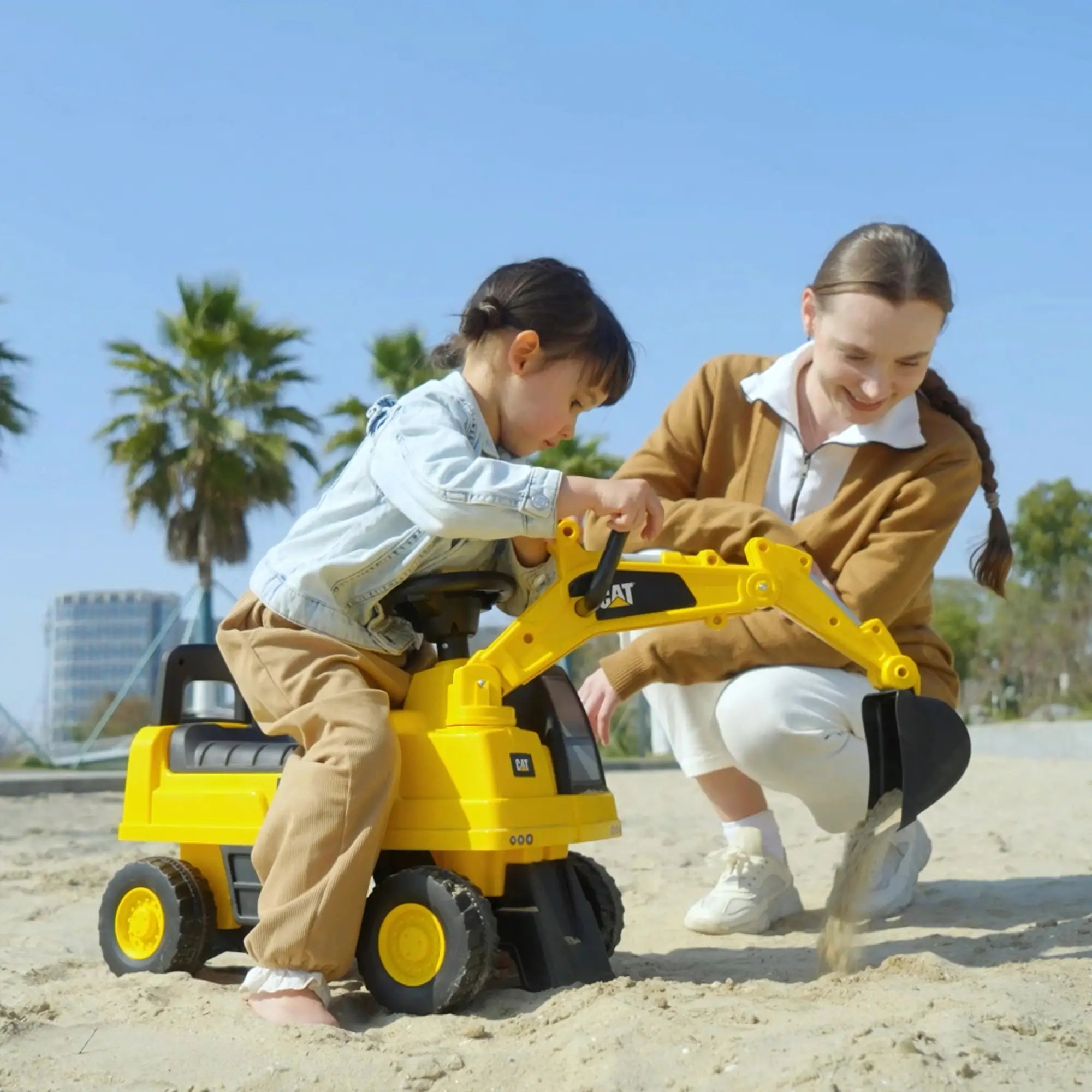 Kids digger ride-on toy featuring comfortable seat and supportive backrest