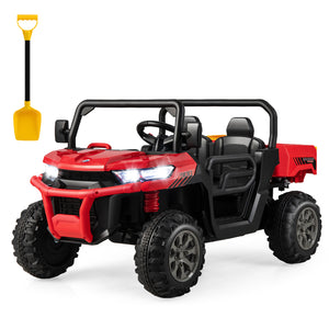 Red and black toy off-road vehicle with a yellow shovel on a white background