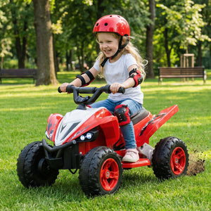 Child riding a red toy quad bike in a park