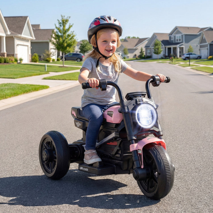 Child riding a pink toy motorcycle on a suburban street