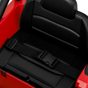 Black car seat cover with a strap on a red vehicle interior