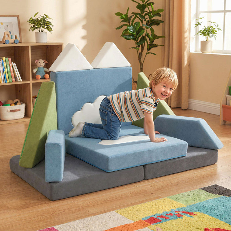 Child playing on a colorful play couch in a room with books and plants.