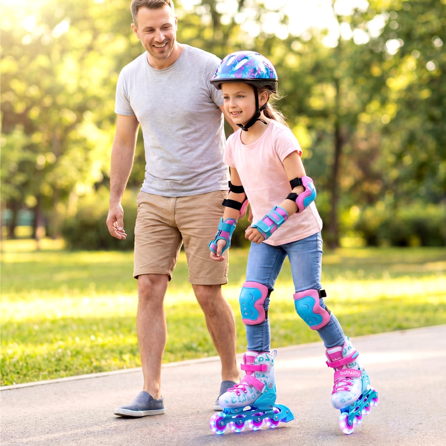 Man and young girl rollerblading together in a park