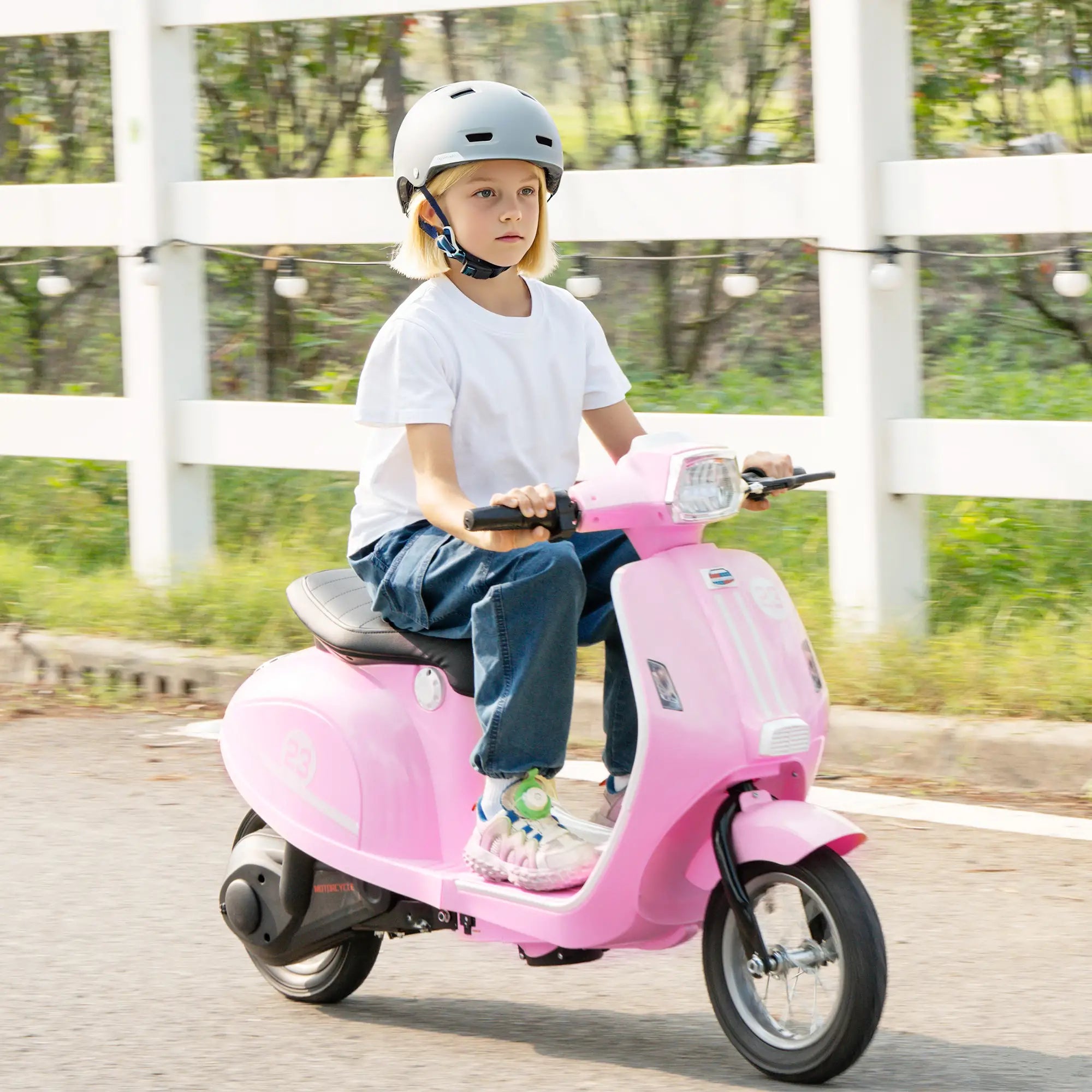 Kids motorcycle riding smoothly on grass surface