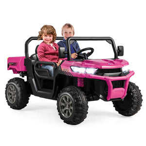 Pink toy off-road vehicle with two children inside on a white background