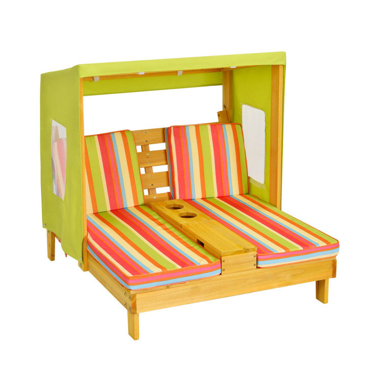 Children's playhouse with colorful striped cushions on a white background
