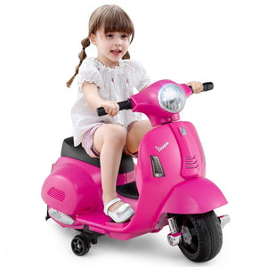 Bright LED headlight on pink Vespa