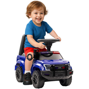 Child sitting in a blue toy truck on a white background