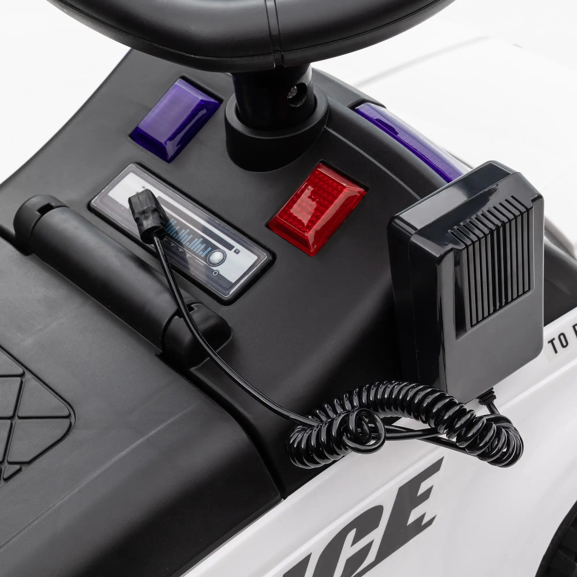 Close-up of a police vehicle's control panel with buttons and a radio.