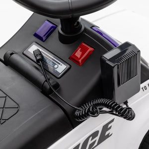 Close-up of a police vehicle's control panel with buttons and a radio.