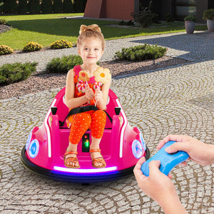 Child in a pink toy car with remote control outdoors
