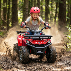 Child riding a red ATV through a muddy forest trail