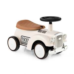 Children's vintage-style toy car with a brown seat on a white background