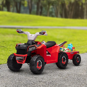 Red toy ATV with a black seat and black wheels on a gravel path with grass and trees in the background.