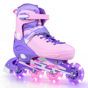 Purple and pink inline skates with LED lights on a white background