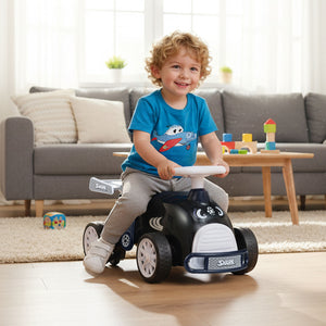 Child playing with a toy car in a living room
