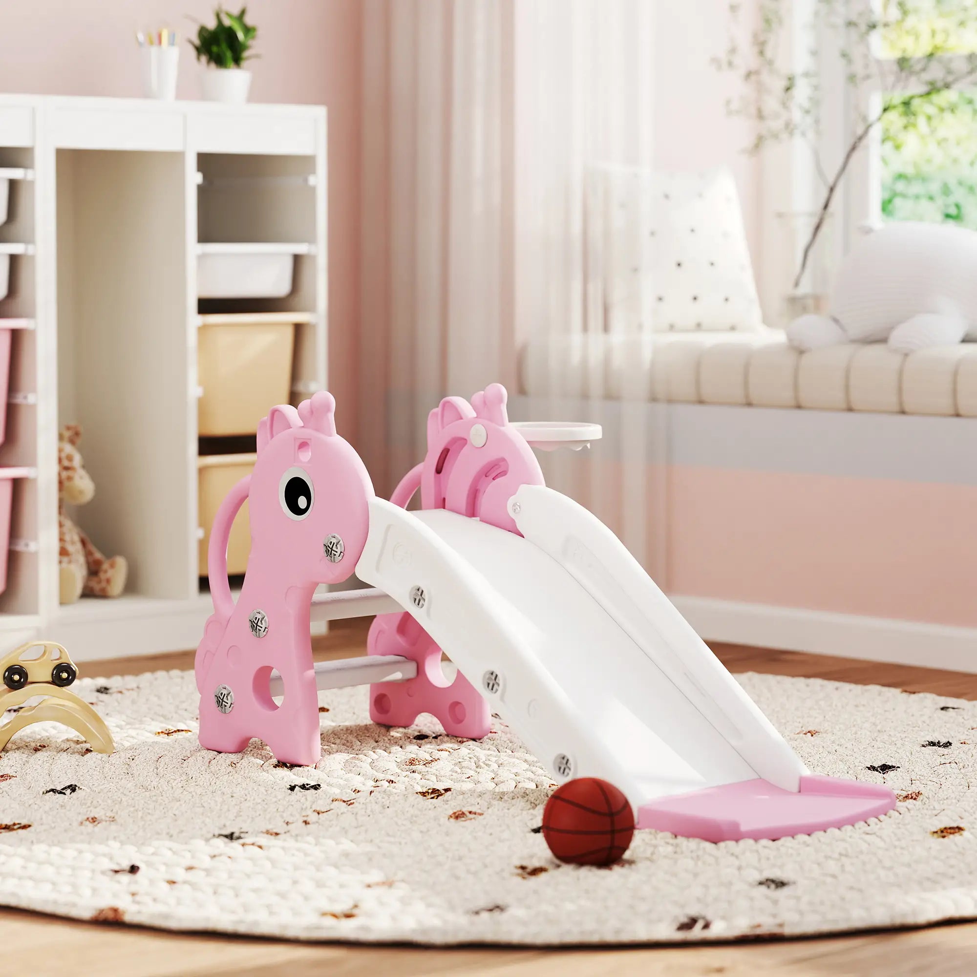 Pink children's slide with horse design on a carpeted floor in a room.