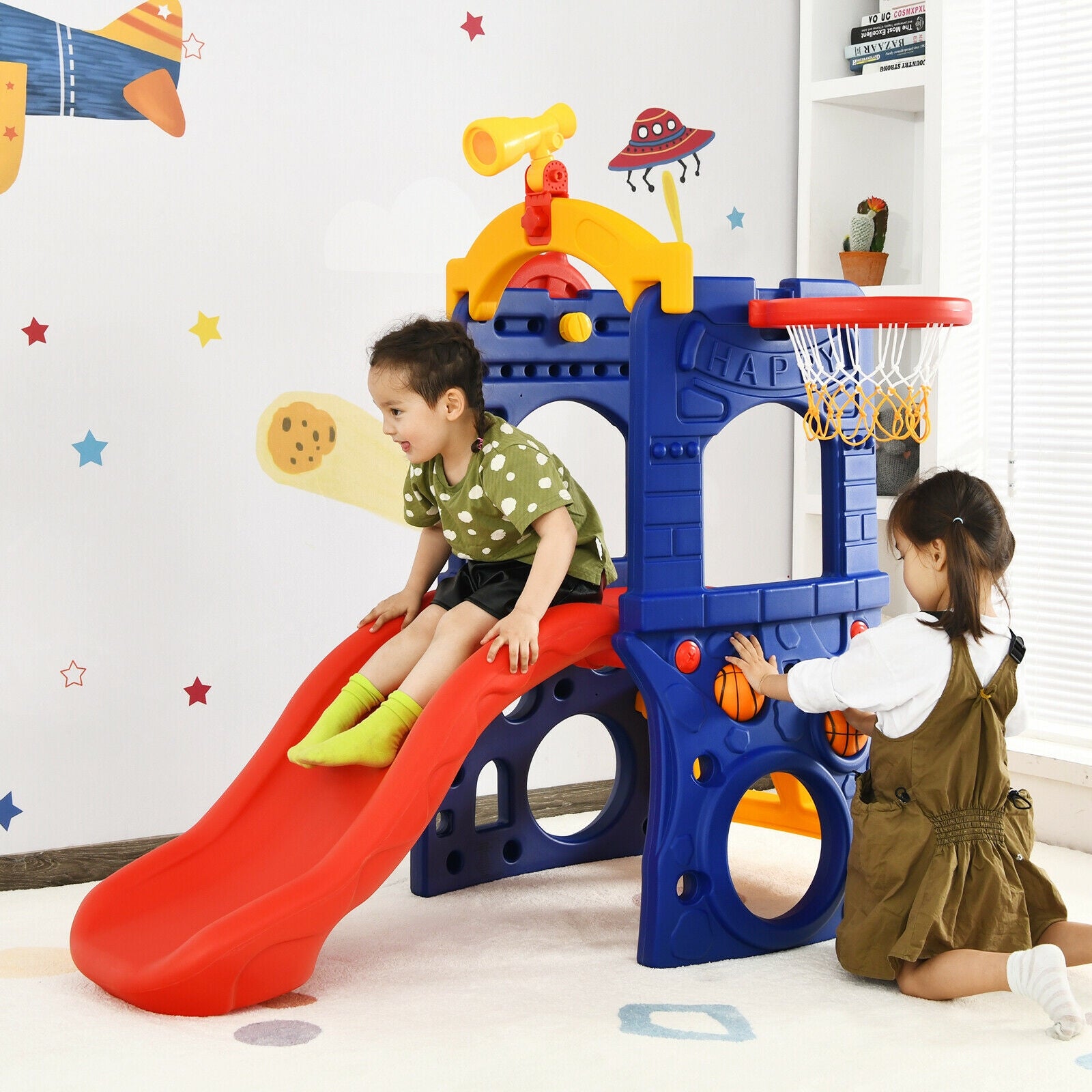 Children playing with a colorful play structure in a room.