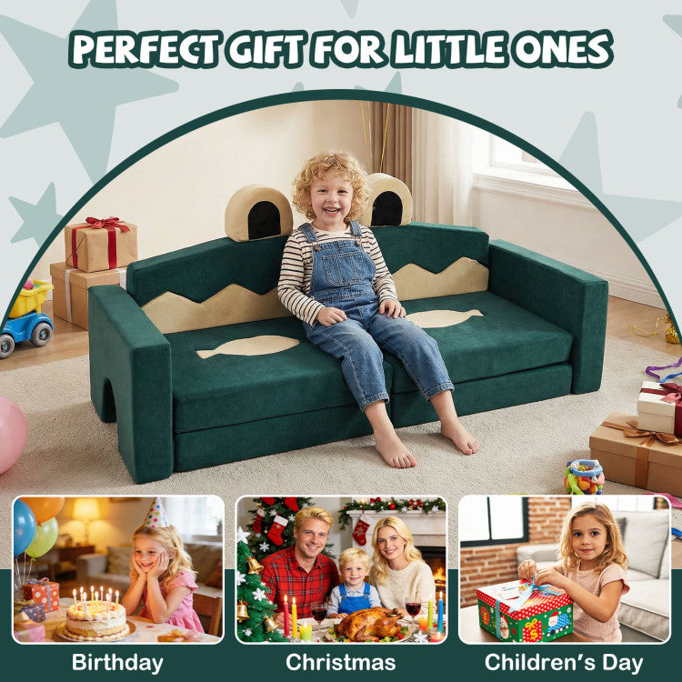 Child sitting on a green play couch with festive decorations and family photos.