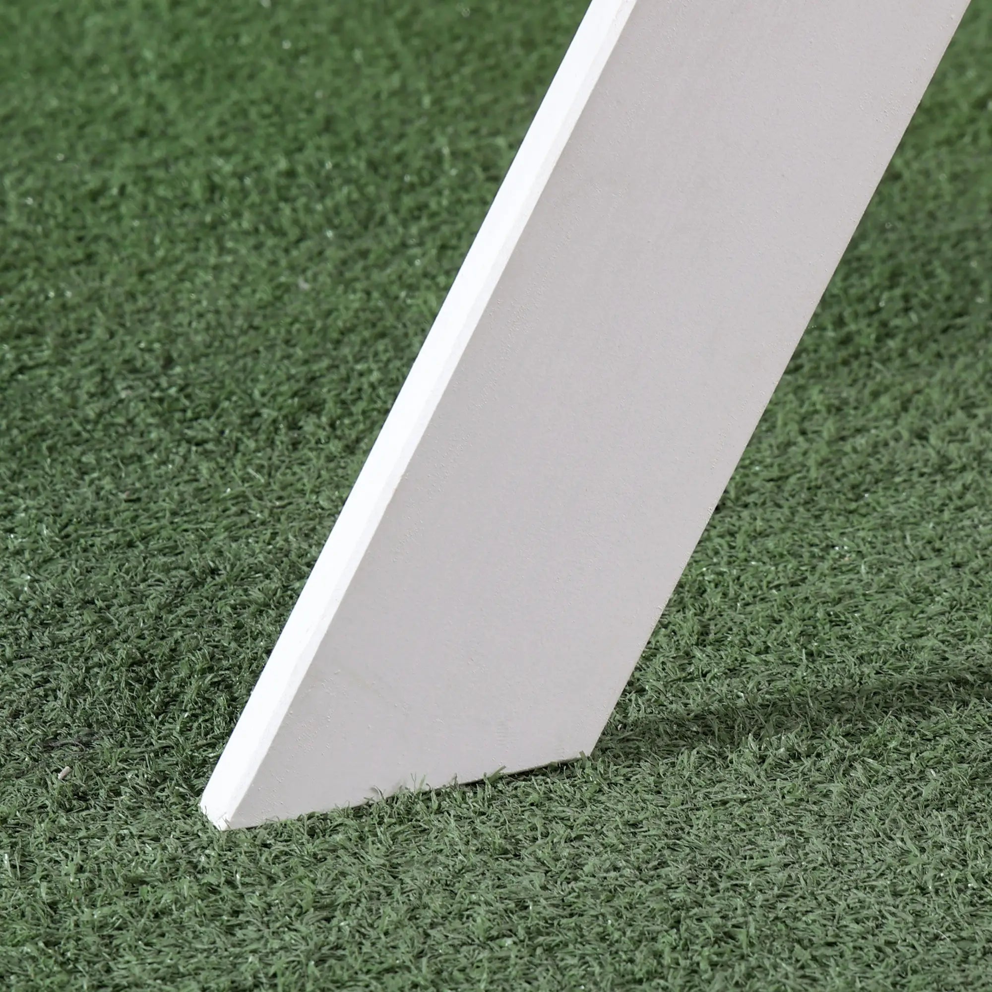 White rectangular tile on artificial grass
