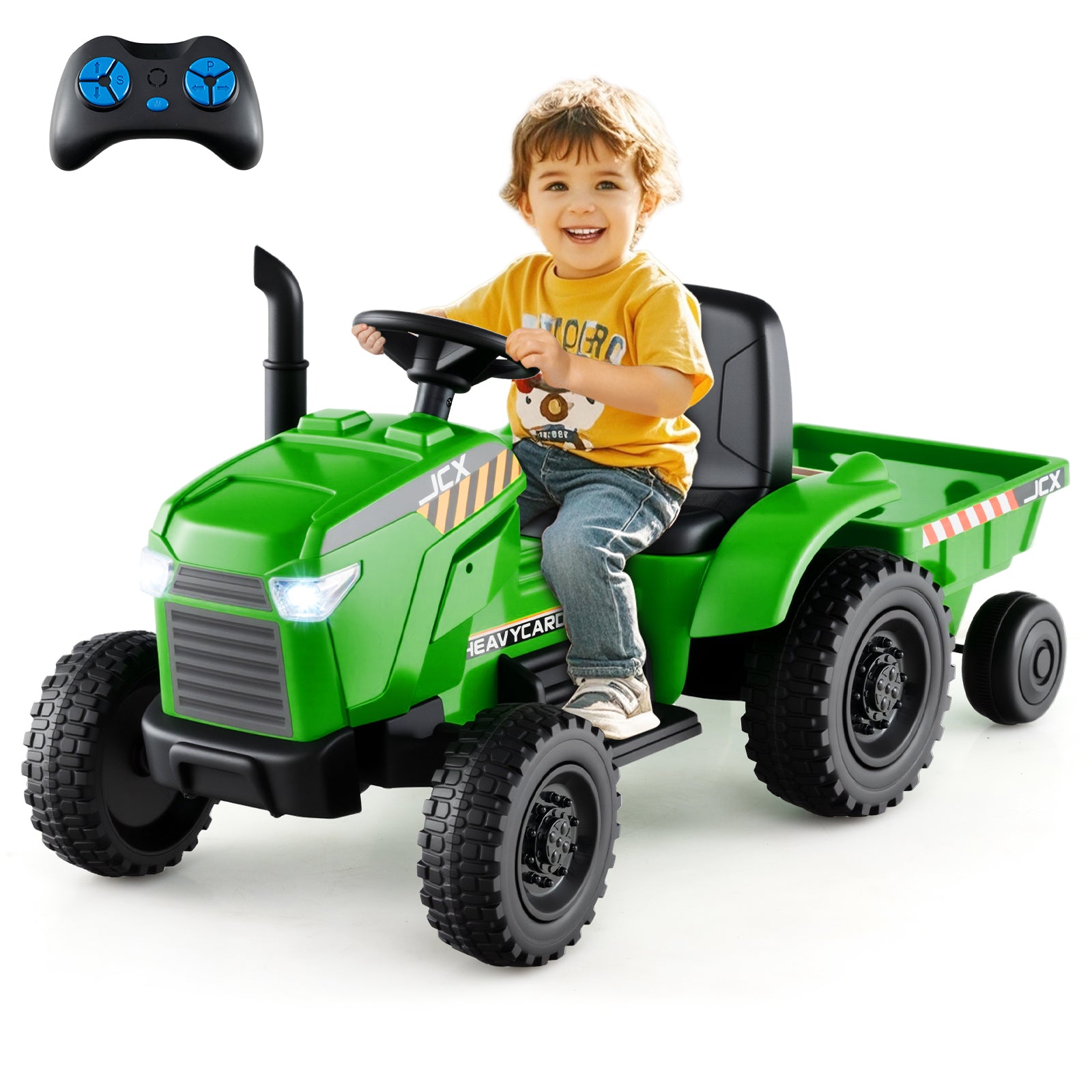 Child sitting in a green toy tractor with a remote control on a white background