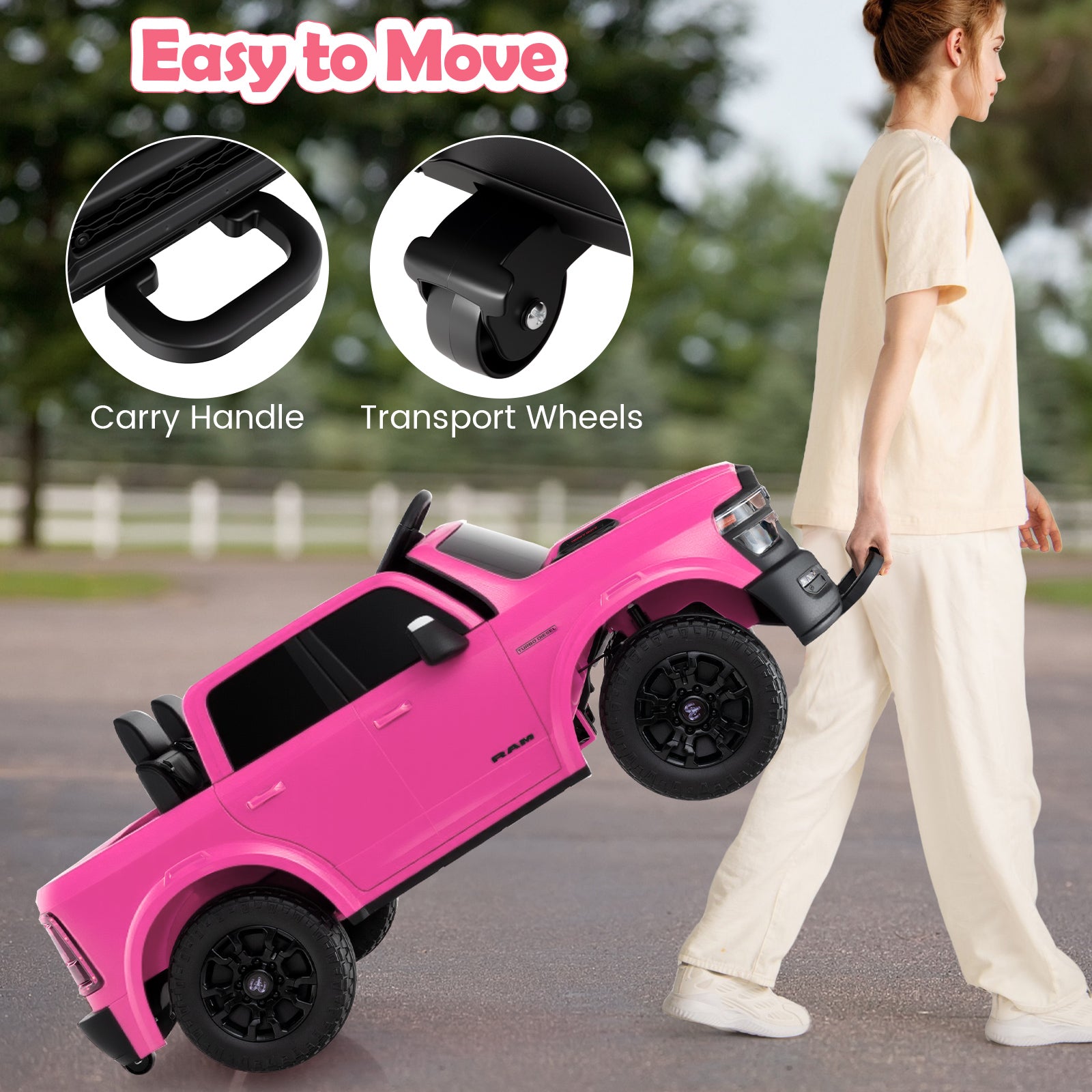 Pink toy car with carry handle and transport wheels, being moved by a person outdoors.