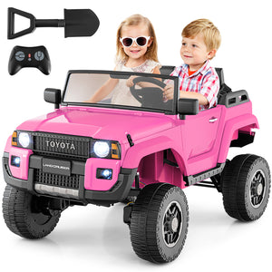 Pink toy car with remote control, shovel, and children sitting inside on a white background