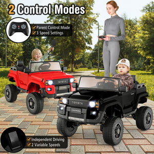 Two toy cars, one red and one black, with a woman and two children outdoors.