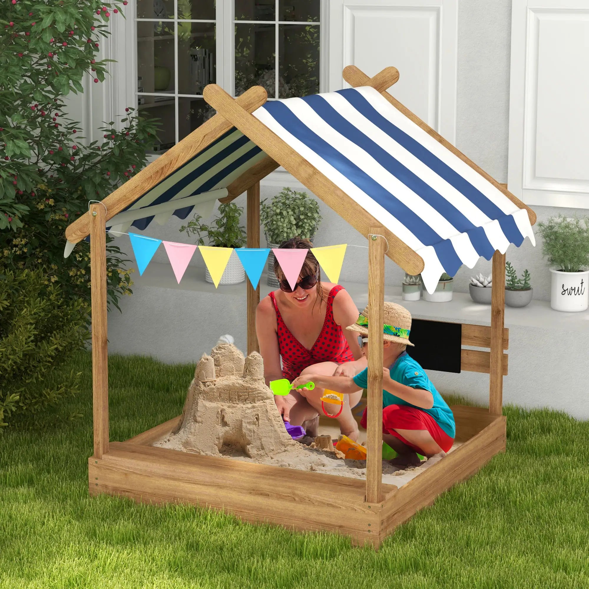 kids sandbox with canopy in backyard