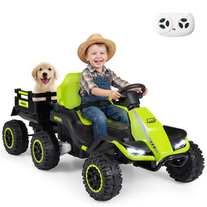 Child driving a green toy truck with a dog in the back, remote control included.