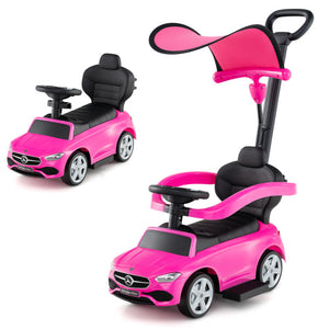 Pink toy car with a seat and handle on a white background